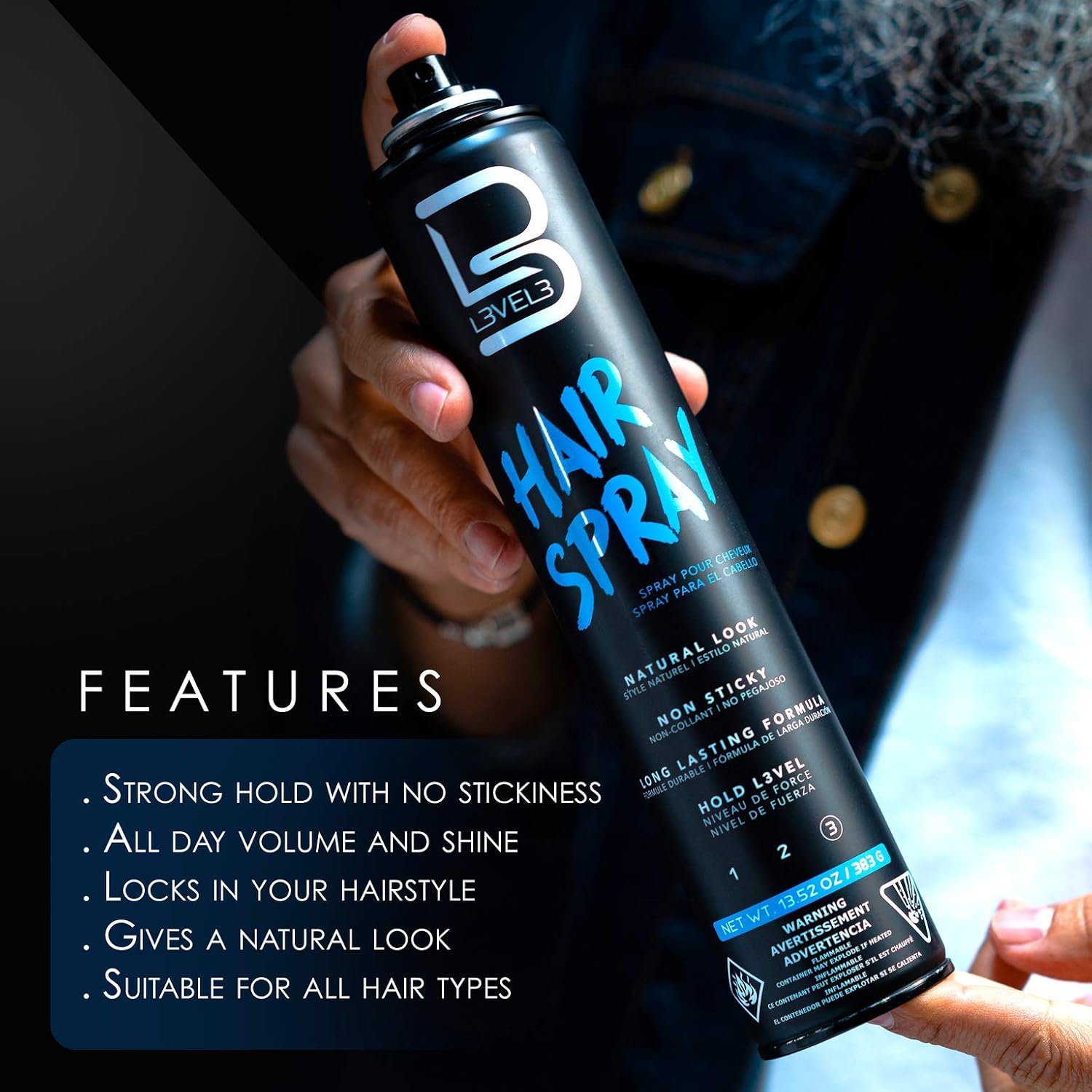 Hand holding a can of hair spray with features listed below.