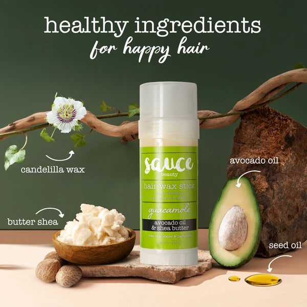 A hair wax stick by Sauce Beauty centered on a styled background with ingredient callouts: candelilla wax, butter shea, avocado oil, and seed oil. The product tube is white with a bright green label reading 'guacamole' and 'avocado oil & shea butter.