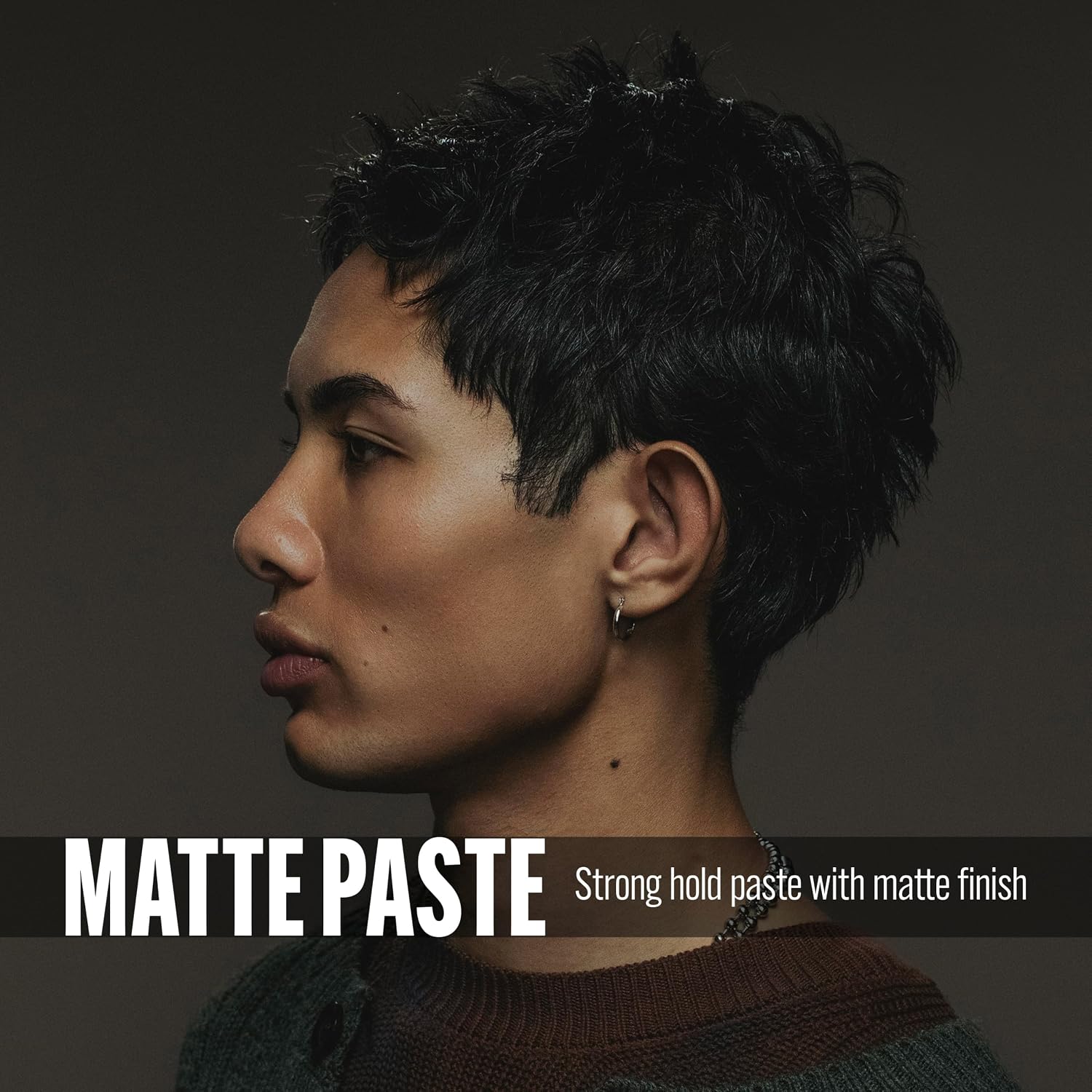 A side-profile portrait of a person with short dark hair wearing matte paste hair product, with text reading 'MATTE PASTE Strong hold paste with matte finish' on a dark gray background.