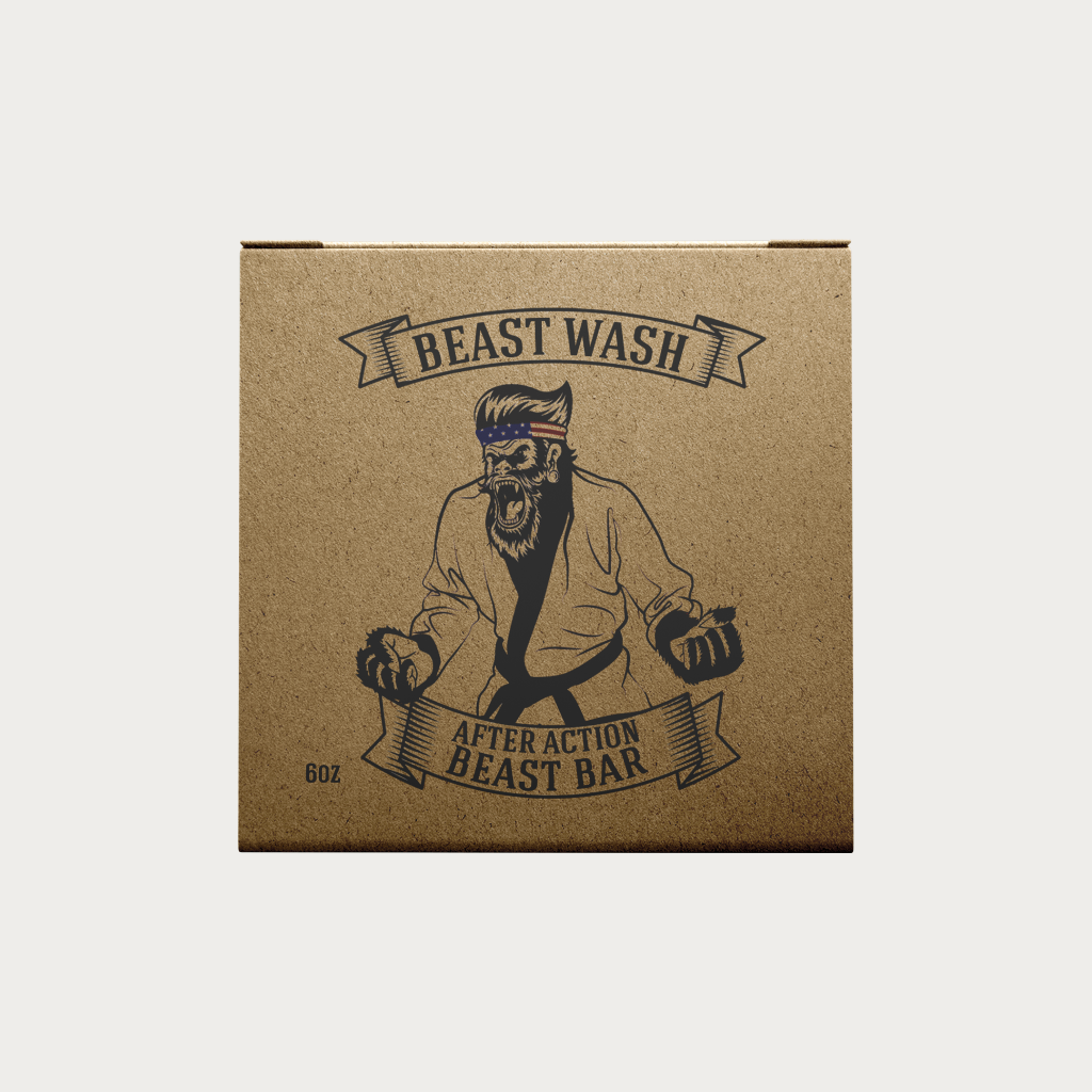 A square brown kraft paper box with a printed graphic of a bearded man wearing a gi and headband, with banners reading 'BEAST WASH' and 'AFTER ACTION BEAST BAR', on a light gray background.